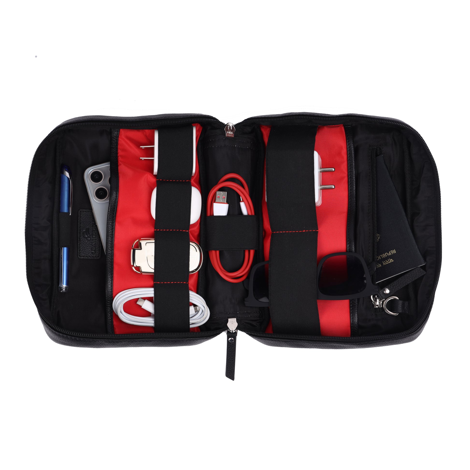 Black and red travel organizer with various items on a white background