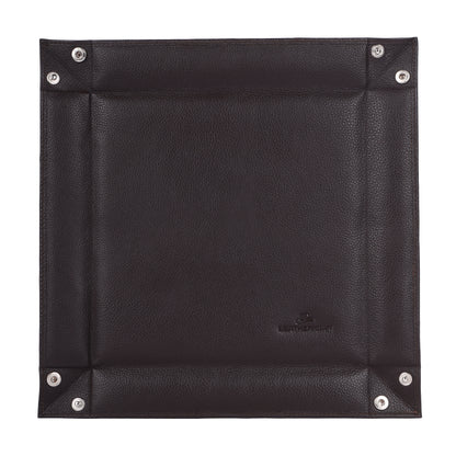 Black leather square with metal studs on a white background