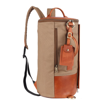 Brown and orange backpack with a leather patch on a white background