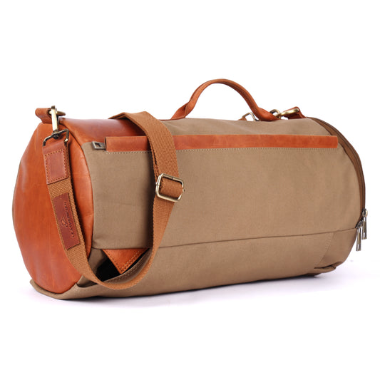 Brown duffel bag with leather accents on a white background