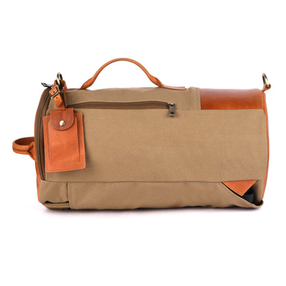 Brown duffel bag with leather accents on a white background