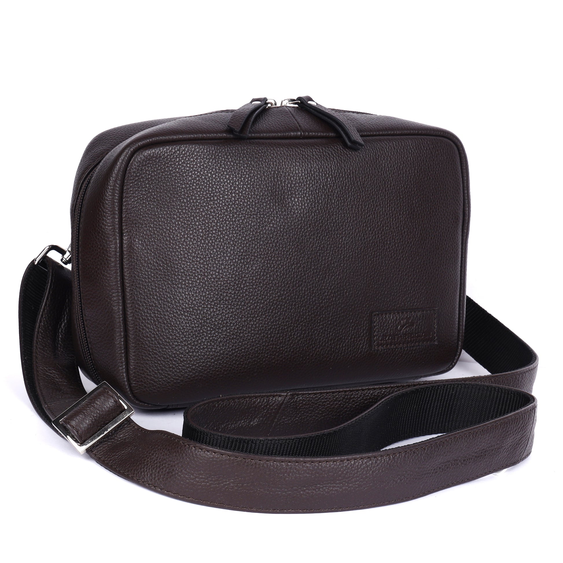 Brown leather shoulder bag with a strap on a white background