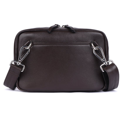 Brown leather bag with a shoulder strap on a white background