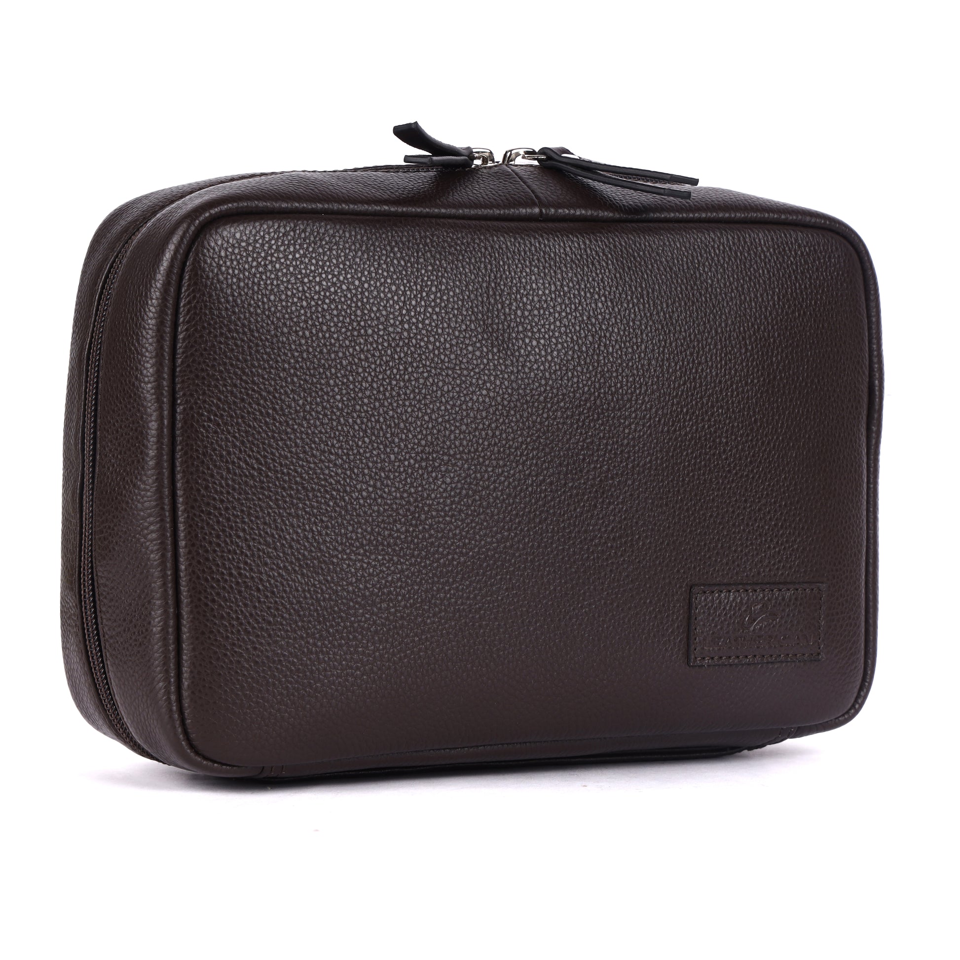 Brown leather toiletry bag on a white background