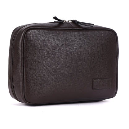 Brown leather toiletry bag on a white background