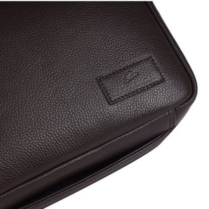 Close-up of a black leather bag with a visible brand logo on a white background