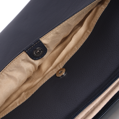 Close-up of a navy blue bag with beige interior lining