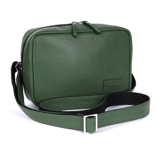 Green leather bag with a strap on a white background