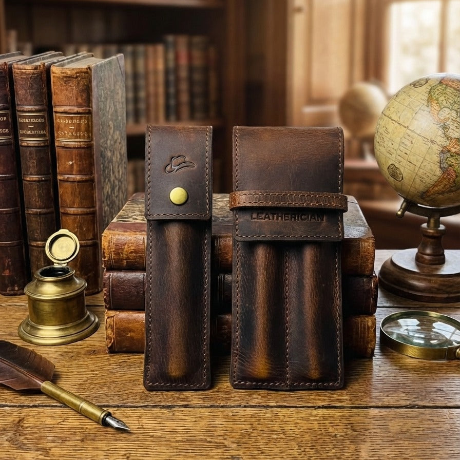 Two leather pouches on a wooden surface with books and a globe in the background